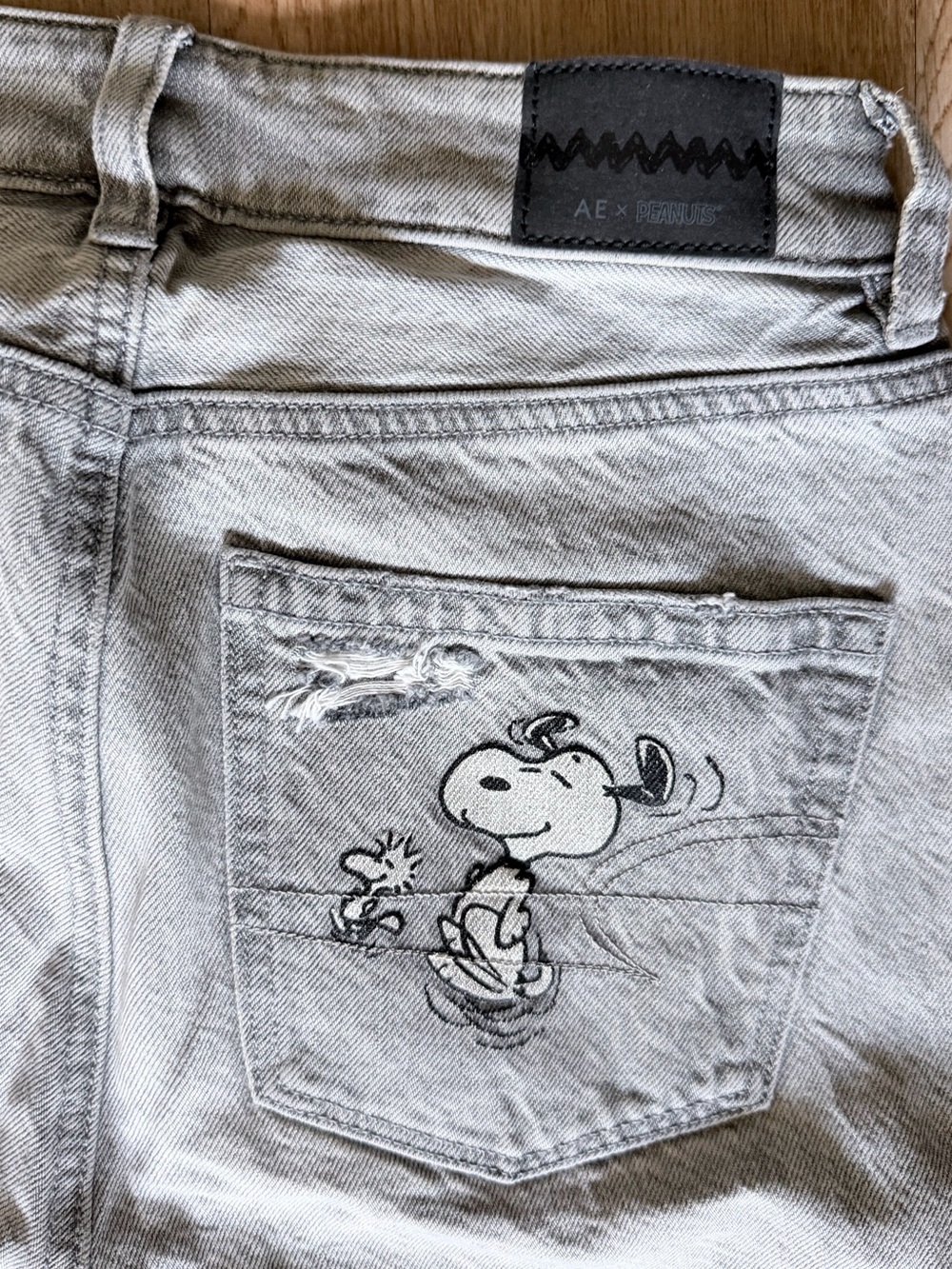 American Eagle Outfitters Light Gray Denim Jeans with Snoopy Lined Pockets